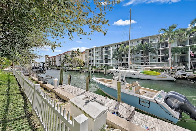 dock area featuring a water view and fence