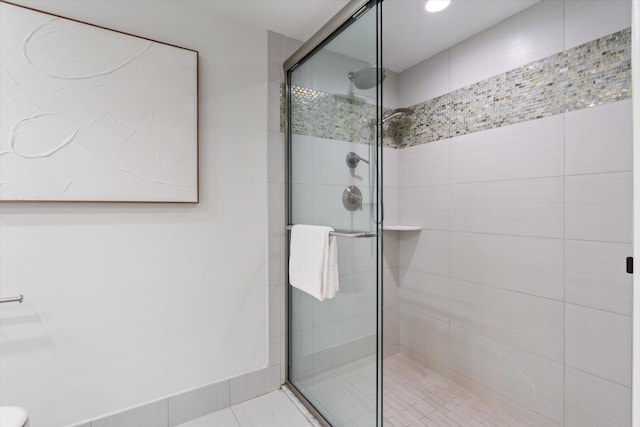 bathroom featuring a shower stall