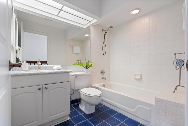 full bathroom with shower / bath combination, a skylight, toilet, tile patterned floors, and vanity