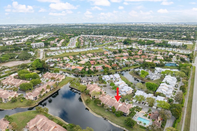 drone / aerial view with a water view and a residential view