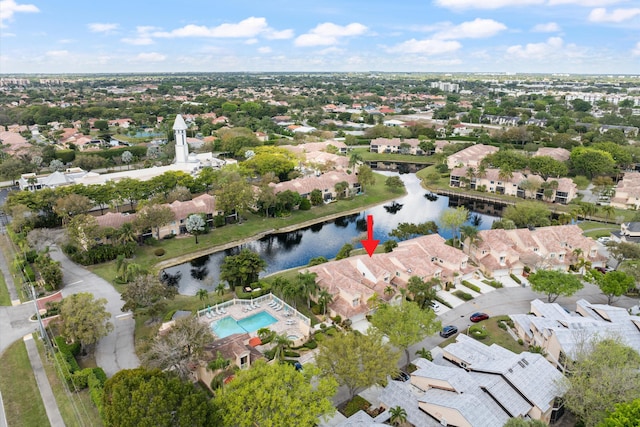 bird's eye view featuring a water view and a residential view