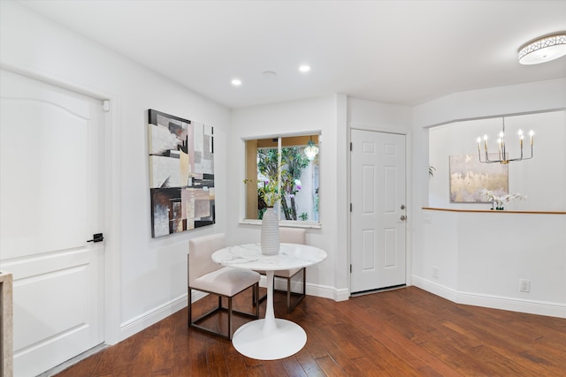 interior space featuring recessed lighting, an inviting chandelier, baseboards, and hardwood / wood-style flooring