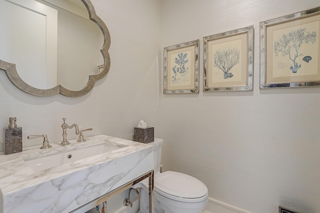 bathroom with vanity and toilet