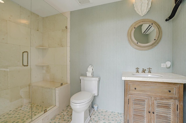 full bathroom featuring toilet, a shower stall, visible vents, and vanity