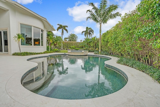 view of pool featuring a pool with connected hot tub