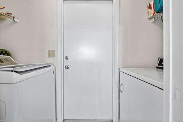 laundry area featuring laundry area and washer and dryer