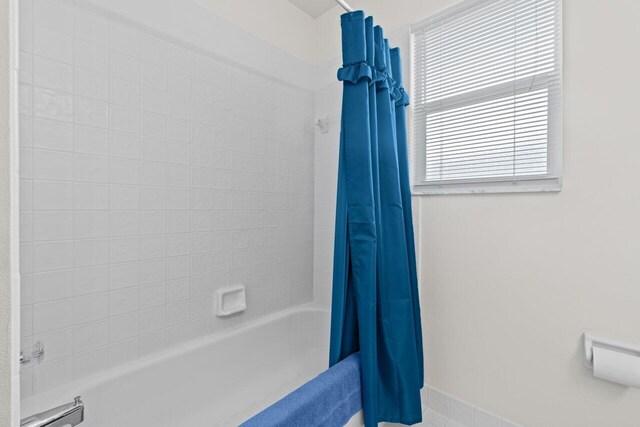 full bathroom featuring shower / tub combo with curtain