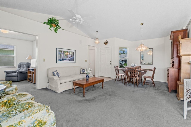 living area with carpet, vaulted ceiling, and ceiling fan