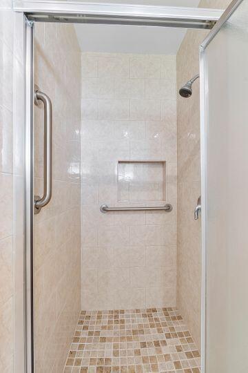 bathroom featuring a stall shower