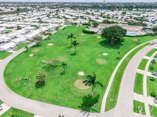 birds eye view of property with a residential view