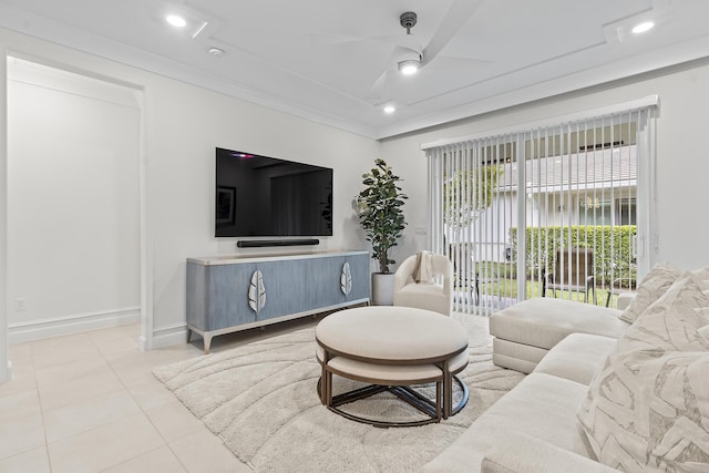 tiled living room with a ceiling fan, recessed lighting, crown molding, and baseboards