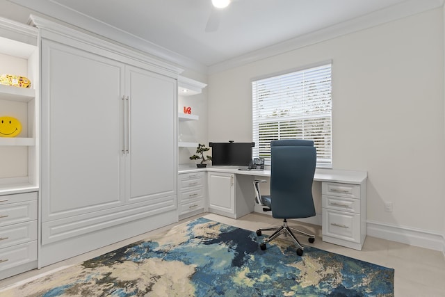 office area with baseboards, a ceiling fan, and crown molding