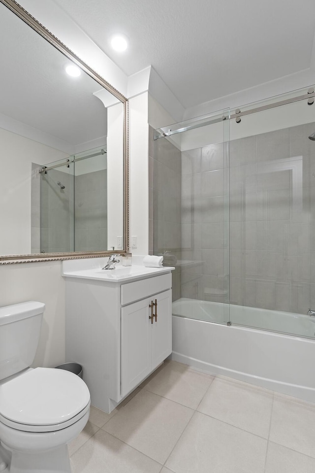 full bathroom featuring recessed lighting, toilet, combined bath / shower with glass door, vanity, and tile patterned flooring