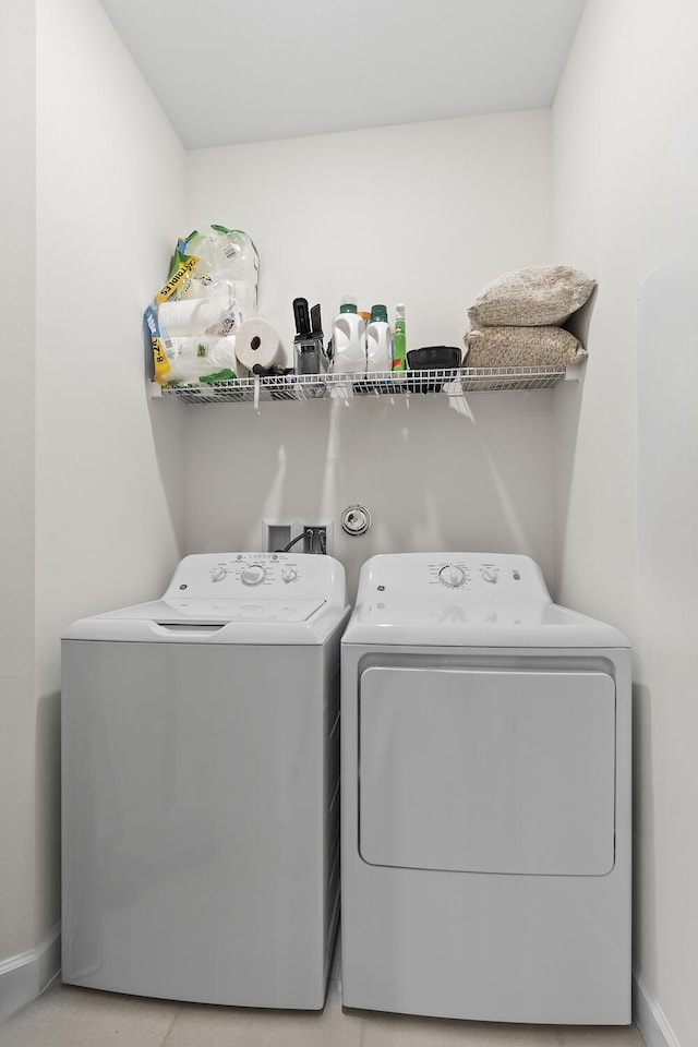 laundry room featuring washer and dryer, laundry area, and baseboards