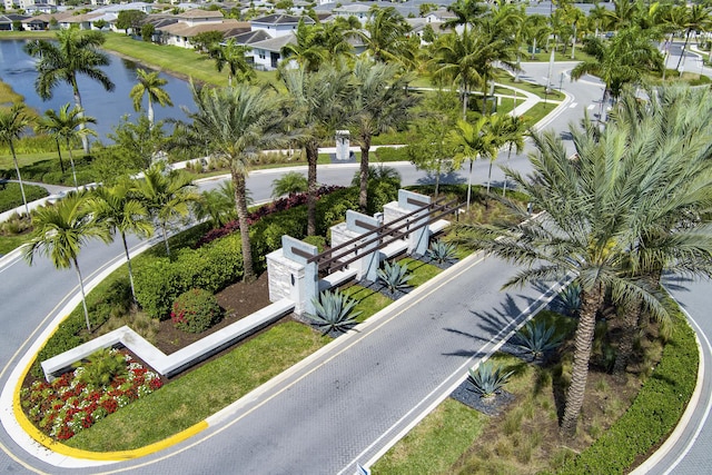 drone / aerial view featuring a residential view and a water view