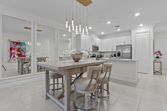 dining room featuring ornamental molding, light tile patterned flooring, visible vents, and recessed lighting