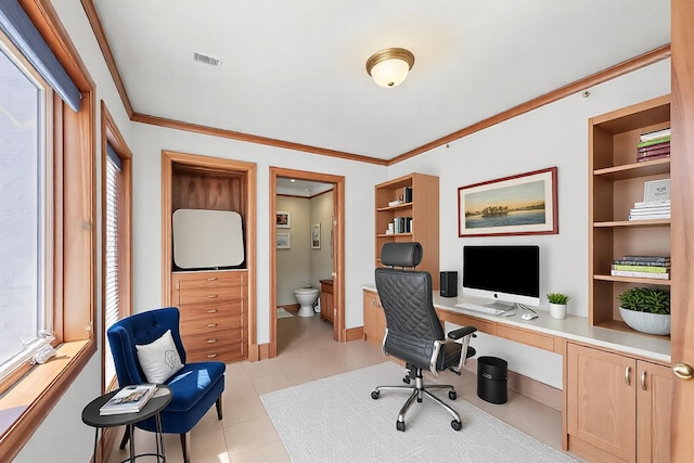 office area featuring light tile patterned floors, visible vents, baseboards, built in features, and ornamental molding