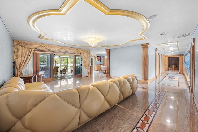 living room with marble finish floor, visible vents, decorative columns, and a notable chandelier