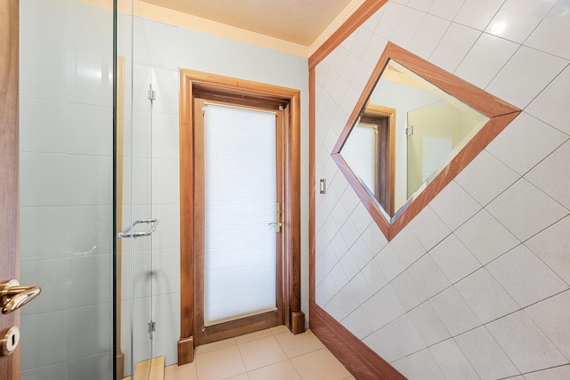 interior space featuring tile walls and tile patterned floors