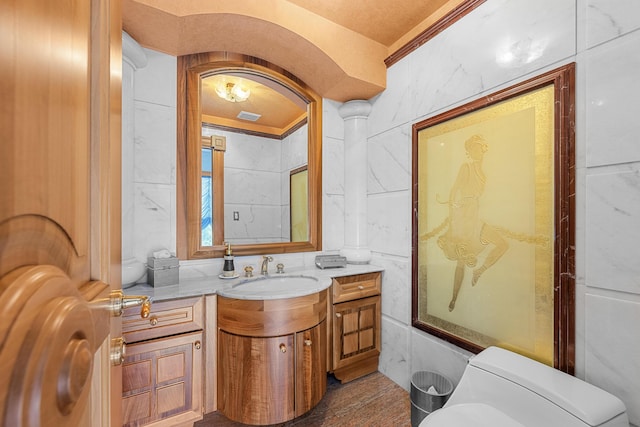 bathroom featuring visible vents, vanity, and toilet