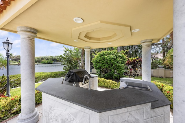 view of patio featuring a water view