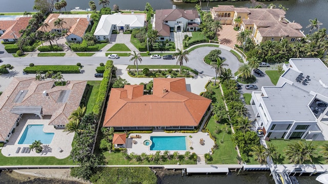 bird's eye view featuring a residential view and a water view