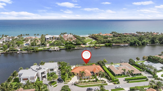 drone / aerial view with a residential view and a water view