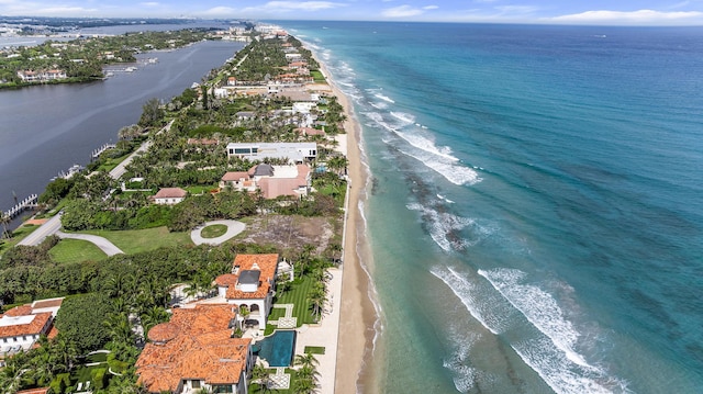 drone / aerial view featuring a view of the beach and a water view