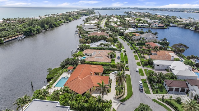 birds eye view of property featuring a water view and a residential view