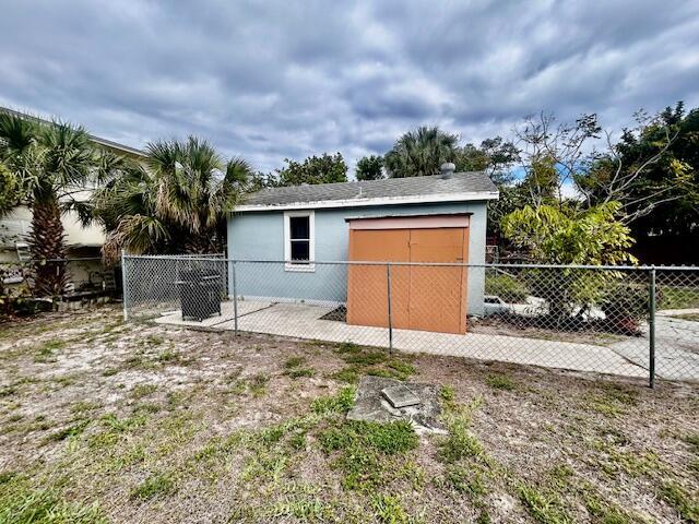 view of outbuilding with fence private yard