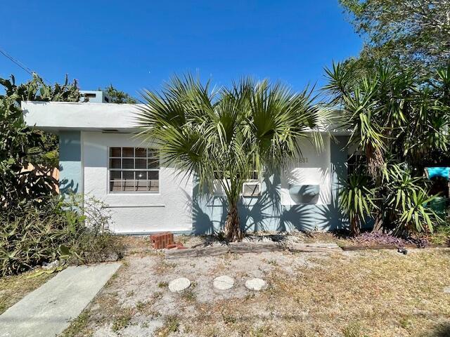 view of side of property with stucco siding