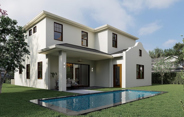 back of property featuring ceiling fan, a lawn, an outdoor pool, and stucco siding