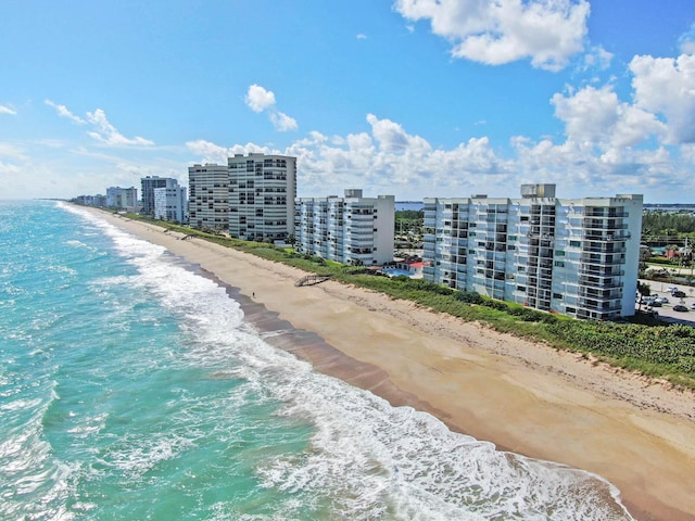 property view of water featuring a view of city and a beach view