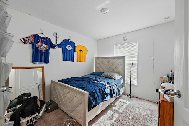 carpeted bedroom with baseboards