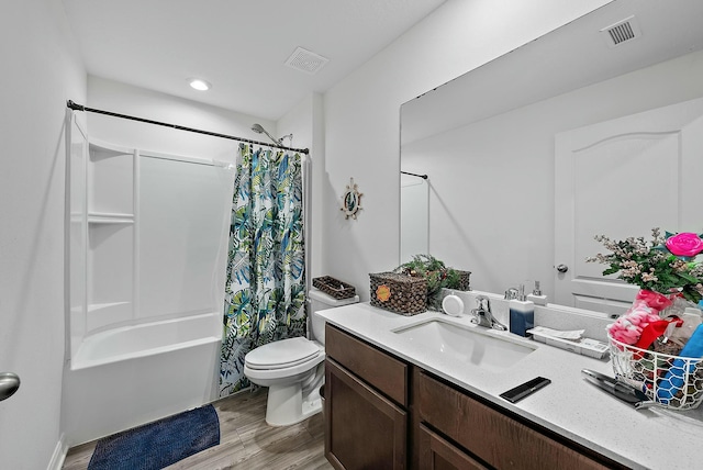 full bath with visible vents, shower / tub combo with curtain, toilet, and wood finished floors