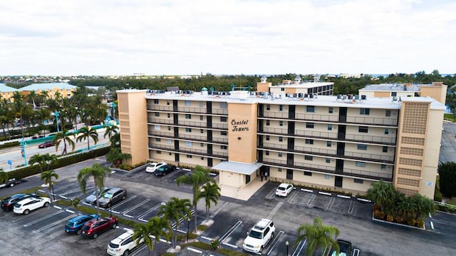 view of property featuring uncovered parking