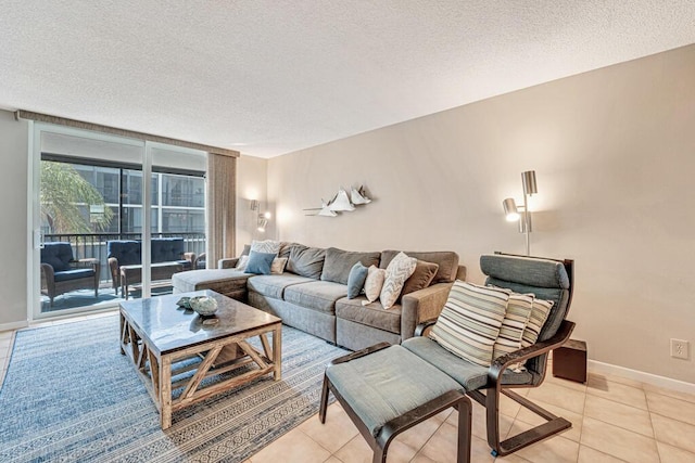 living area with light tile patterned floors, floor to ceiling windows, baseboards, and a textured ceiling