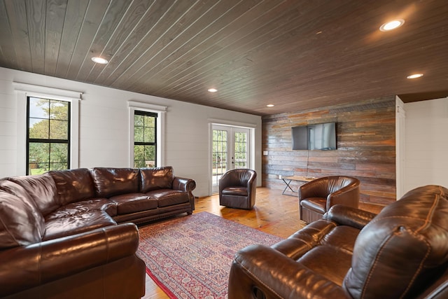 living area featuring recessed lighting, wood walls, wood ceiling, french doors, and light wood-type flooring