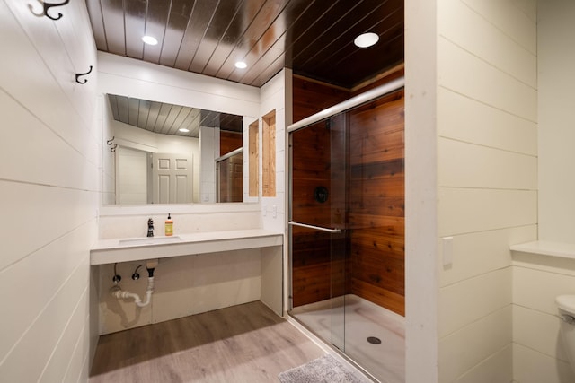 full bath featuring a stall shower, wood ceiling, recessed lighting, and wood finished floors