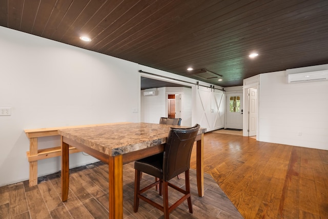 dining space with a barn door, wood ceiling, wood finished floors, a wall mounted air conditioner, and recessed lighting