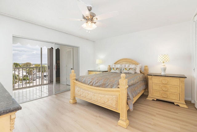 bedroom featuring access to exterior, light wood-type flooring, and ceiling fan