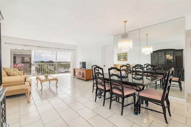 dining area featuring light tile patterned flooring, visible vents, and an inviting chandelier