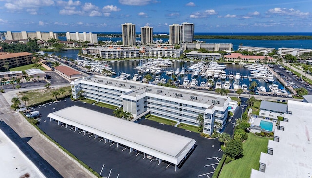 drone / aerial view with a view of city and a water view