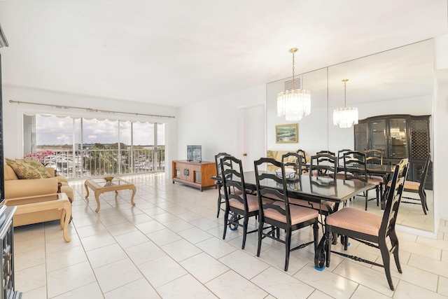 dining room featuring an inviting chandelier, light tile patterned floors, and visible vents