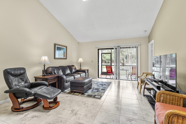 living room with high vaulted ceiling, baseboards, and light tile patterned floors