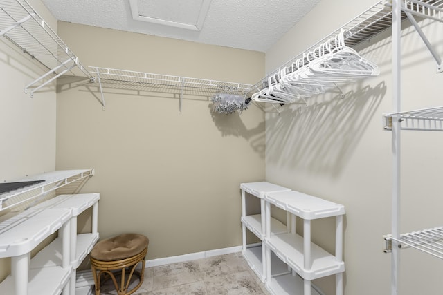 walk in closet with attic access