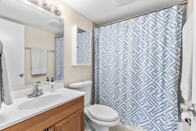 bathroom featuring toilet, a shower with curtain, and vanity