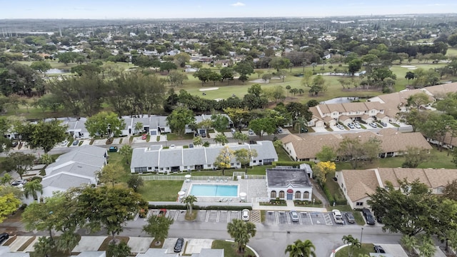 drone / aerial view featuring a residential view and golf course view