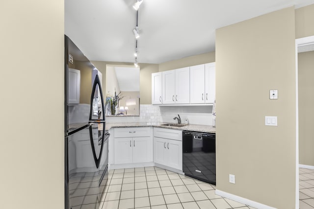 kitchen featuring black appliances, tasteful backsplash, light tile patterned floors, and white cabinets