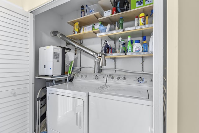 laundry area featuring laundry area and washing machine and clothes dryer